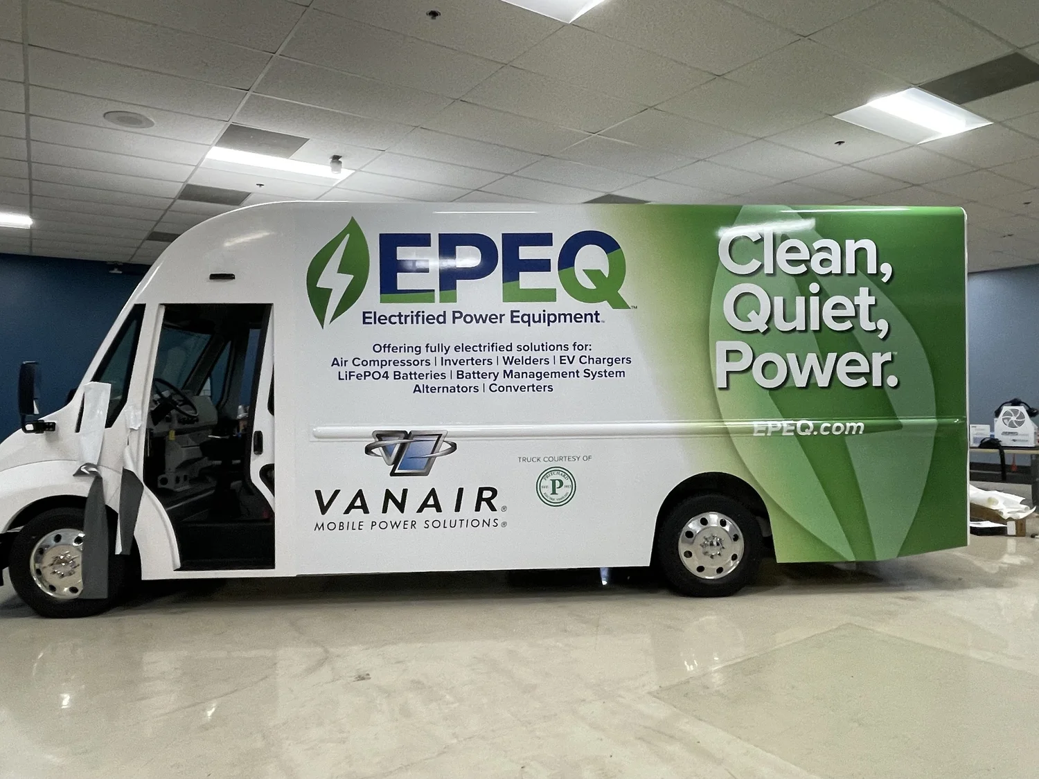 A white and green EPEQ commercial step truck with large company graphics